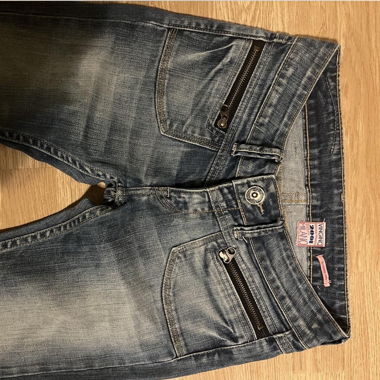 Jean skinny taille basse avec détails de fermeture éclair