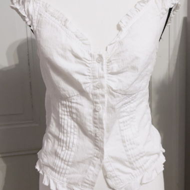 White ruffled sleeveless top