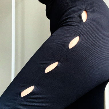 Tight black flare pants with holes on side