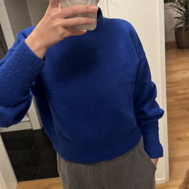 Blue knit turtleneck sweater