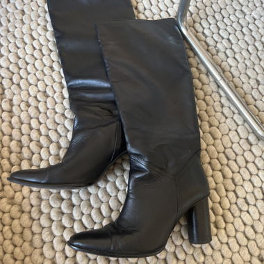 Black knee-high leather boots