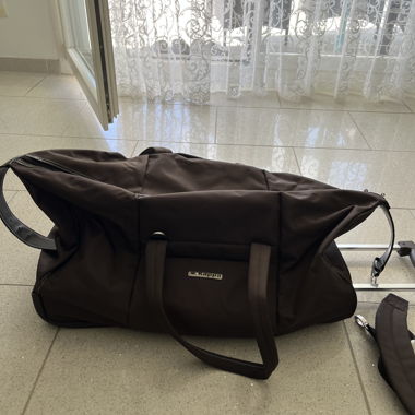 Valise cabine à roulettes brune