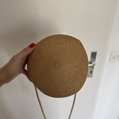 Round bast fiber shoulder bag with crossbody strap