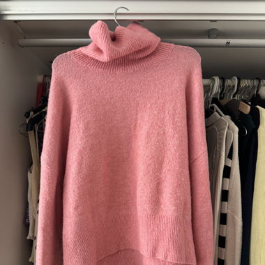 Pull rose tricoté
