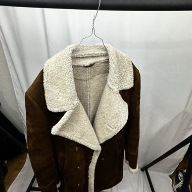Cappotto effetto pelle di agnello in lana