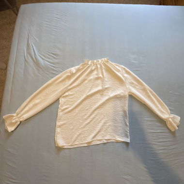 White long-sleeve blouse with ruffle collar