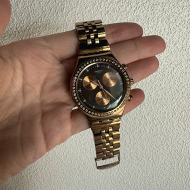 Gold Swatch watch