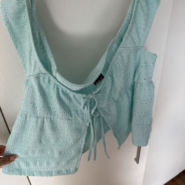 Mint green women’s top with lacing