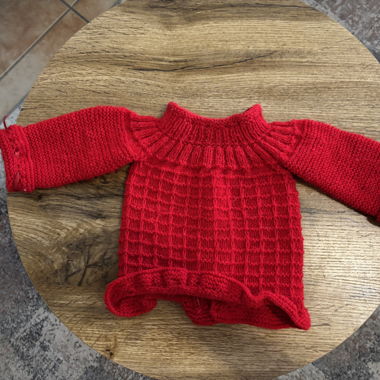 Handmade knitted baby top