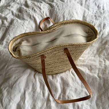Woven straw bag with leather handles