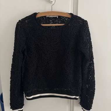 Black lace sweater with striped hem
