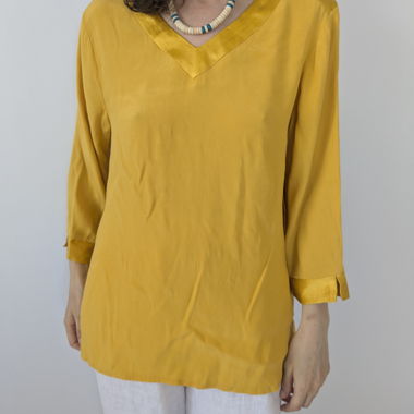 Blusa gialla con scollo a V taglia M