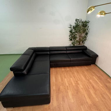 Corner sofa in black leather by Ewald Schillig
