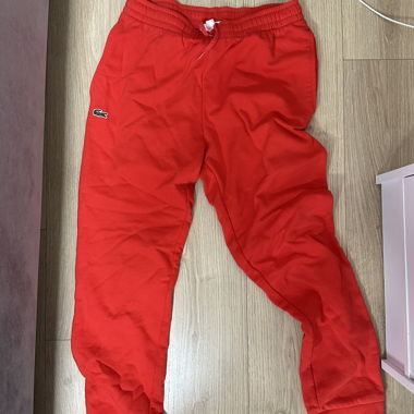 Pantaloni della tuta Lacoste rossi
