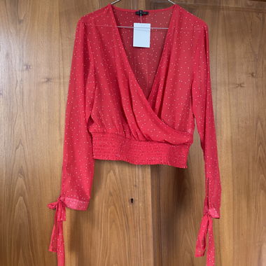 Blusa a portafoglio a pois rossi