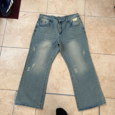 Light blue faded Acne studios style bootcut jeans