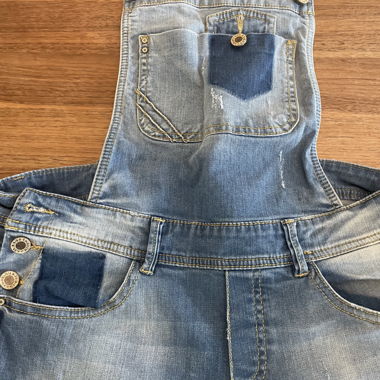 Denim dungarees with distressing