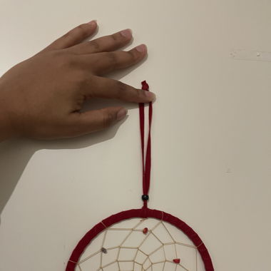 Red dream catcher from Indonesia with feathers
