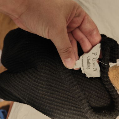 Black knit sweater by Pura Clothing