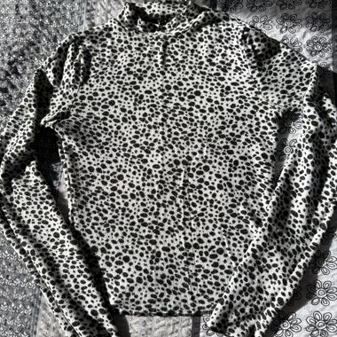 Sweater with black-and-white leopard print.