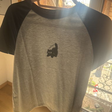 Top con motivo di gatto