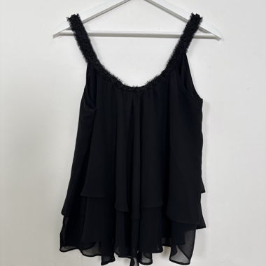 Blusa nera senza maniche con dettagli floreali