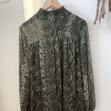 green dress with crocodile patterns