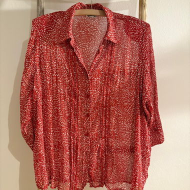 Red blouse with white pattern
