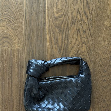 Woven black handbag