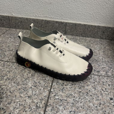 White lace-up shoes