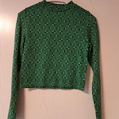 grüner psychadelischer Pullover mit Kreisen