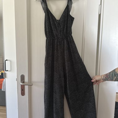 Schwarzer gepunkteter Jumpsuit