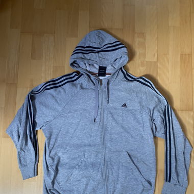 Grey adidas hoodie with stripes on the sleeves 