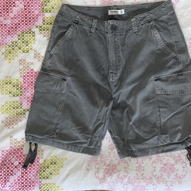 Grey cargo shorts with adjustable waist and cuffs