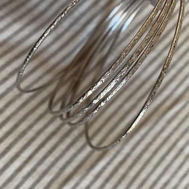 Small delicate bracelets with ornaments