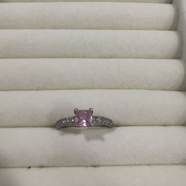 Silver-colored ring with pink stone