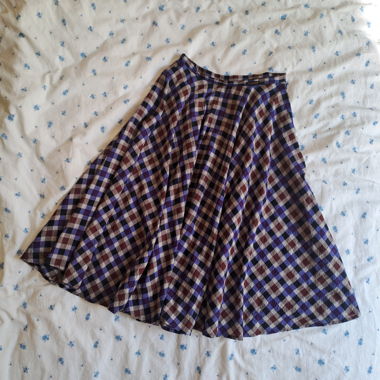 Purple plaid midi skirt with a grunge vibe