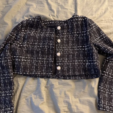 Schwarze Boucle-Jacke