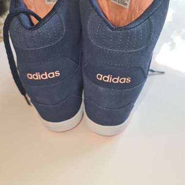 Navy blue adidas high-top sneakers with platform sole