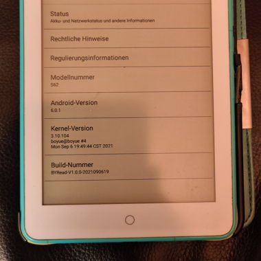 E-reader with stack of books