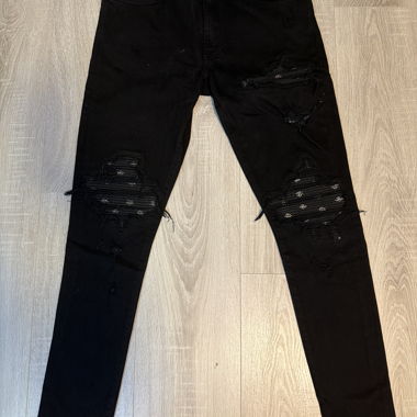 Jeans neri strappati