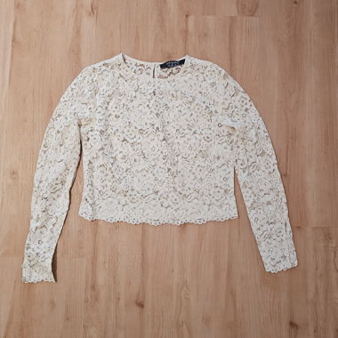 Blusa in pizzo a maniche lunghe