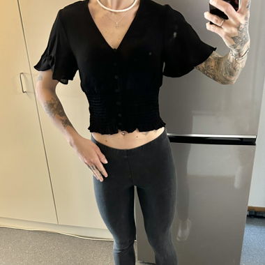 Black blouse with button placket