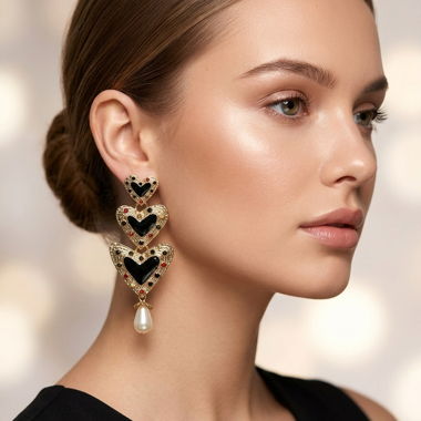 Boucles d’oreilles pendantes coeurs dorés