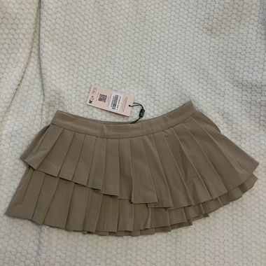 Jupe courte plissée beige Oh Polly