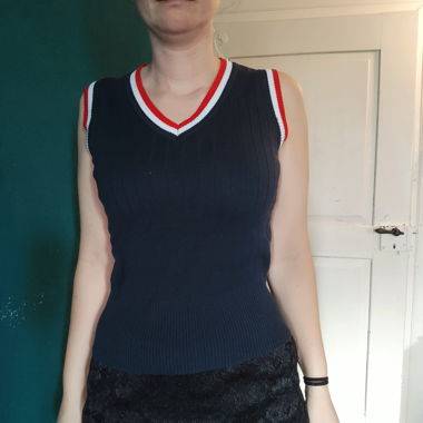 Dark blue knitted sleeveless top with V-neck