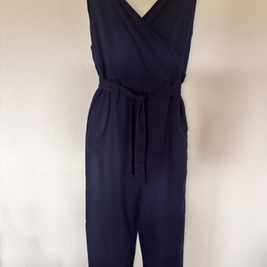 Navy blue jumpsuit with tie waist.