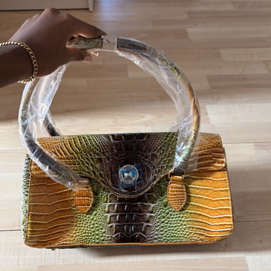 Patent leather handbag with crocodile embossing