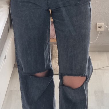 Baggy jeans with holes at the knees