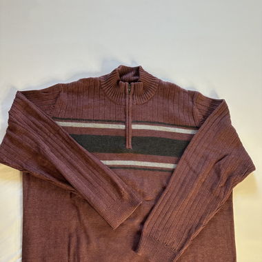 Red sweater with white and black stripes